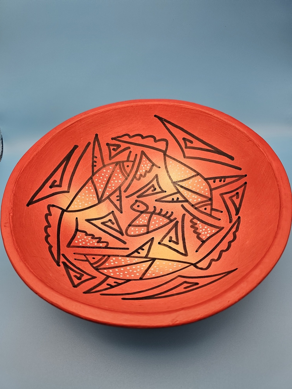Hand-Painted Red Decorative Art Bowl with Tribal Fish Motif